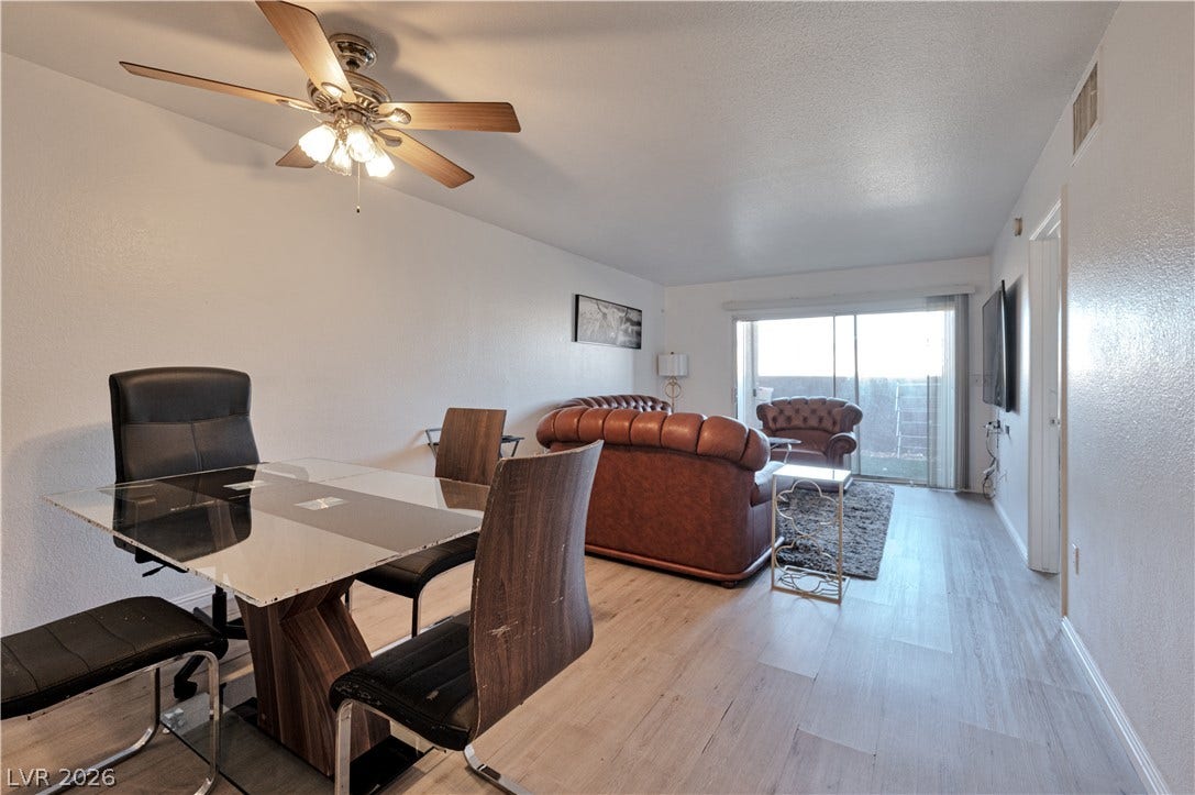 Light-filled dining area features smooth flooring and seamless access to the living space.