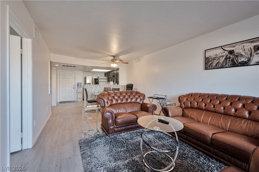 An open floorplan seamlessly connects the central living space to the adjacent dining area.