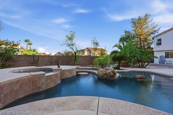 9726 Sweet Jasmine Drive, Las Vegas, NV 89148 A sparkling freeform swimming pool and integrated spa anchor this private outdoor oasis.