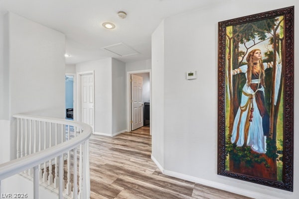 9726 Sweet Jasmine Drive, Las Vegas, NV 89148 Rich wood-textured flooring complements the white balustrade lining this upper-level hallway.