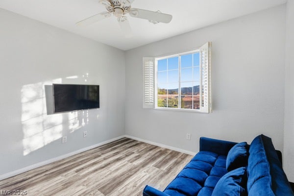 9726 Sweet Jasmine Drive, Las Vegas, NV 89148 Plank flooring and wood shutters highlight this serene secondary living area with mountain views.