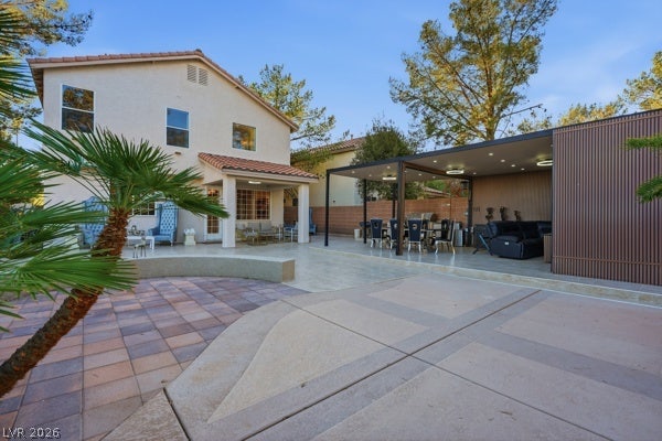 9726 Sweet Jasmine Drive, Las Vegas, NV 89148 An expansive paved patio extends from the home to a covered outdoor lounge area.