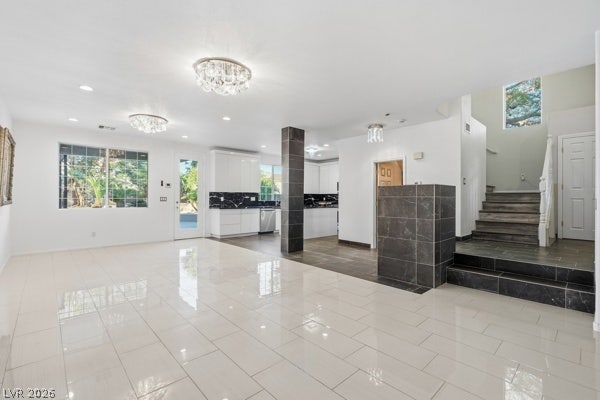 9726 Sweet Jasmine Drive, Las Vegas, NV 89148 Gleaming tile floors and a soaring multi-level design anchor this modern open floorplan.