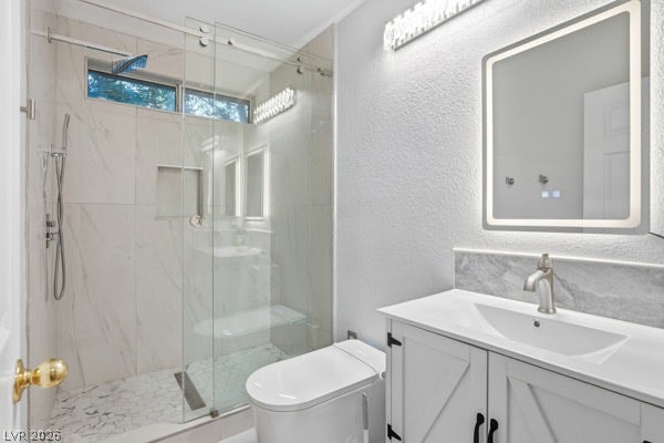9726 Sweet Jasmine Drive, Las Vegas, NV 89148 Modern marble-patterned tile wraps the walk-in glass shower in this updated bath.