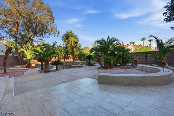 9726 Sweet Jasmine Drive, Las Vegas, NV 89148 Lush palm trees and paved walkways define this expansive outdoor retreat.