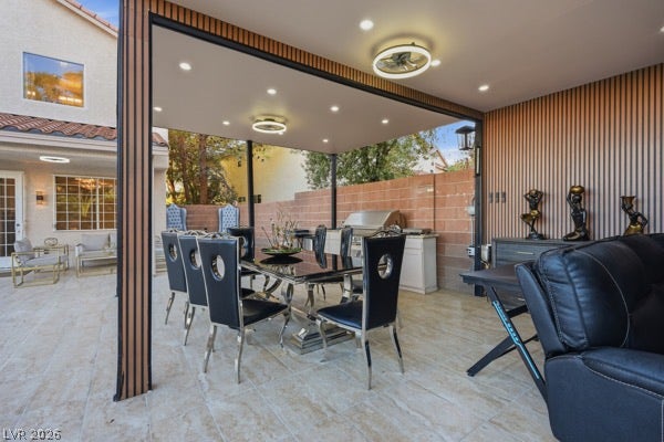 9726 Sweet Jasmine Drive, Las Vegas, NV 89148 An inviting covered patio features modern wood-paneled walls and tiled flooring.