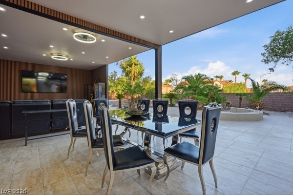 9726 Sweet Jasmine Drive, Las Vegas, NV 89148 An open-air dining terrace with smooth stone tile flooring leads directly to the sunny backyard.