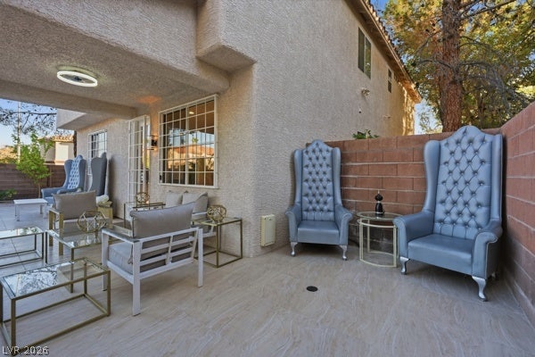 9726 Sweet Jasmine Drive, Las Vegas, NV 89148 Tiled flooring and a stucco exterior frame this private outdoor patio space.
