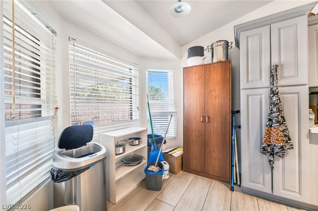 125 Heather Drive, Henderson, NV 89002 Ample natural light highlights the wood-look flooring and custom cabinetry in this utility space.