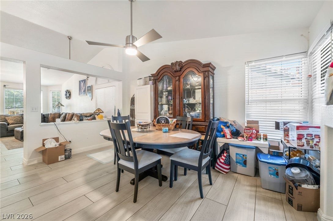 125 Heather Drive, Henderson, NV 89002 An open dining area showcases vaulted ceilings and light wood-look tile flooring.
