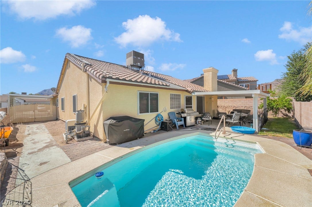 125 Heather Drive, Henderson, NV 89002 A classic tiled roof and stucco exterior frame this private backyard retreat.