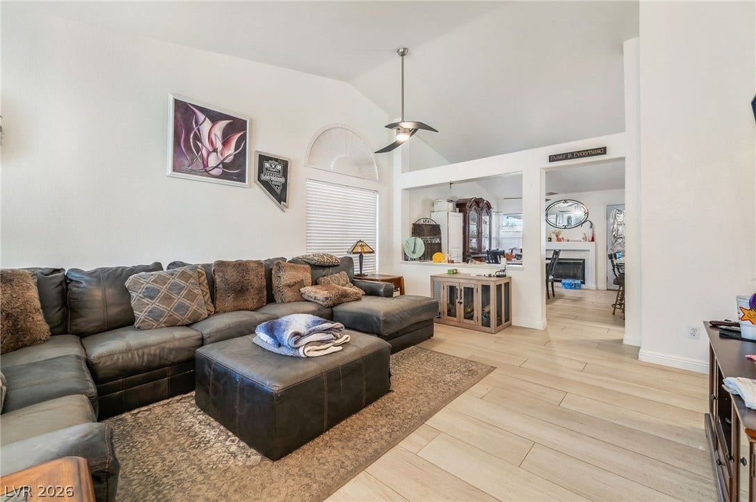 125 Heather Drive, Henderson, NV 89002 Vaulted ceilings and wood-look flooring enhance the open, flowing layout of this main living area.