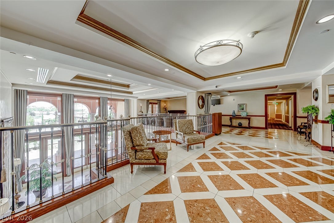 30 Strada Di Villaggio, #151, Henderson, NV 89011 Gleaming inlaid tile floors and elegant tray ceilings define this expansive upper-level landing space.