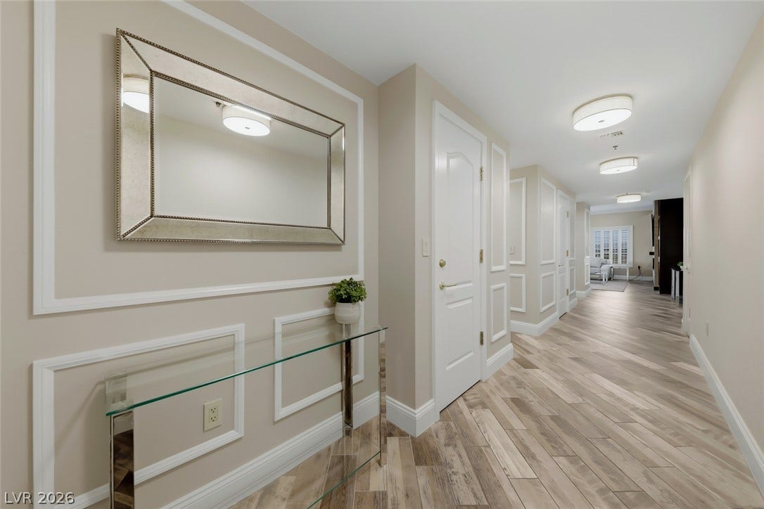 30 Strada Di Villaggio, #151, Henderson, NV 89011 Elegant wainscoting and wood-look tile flooring line this welcoming entry hall.