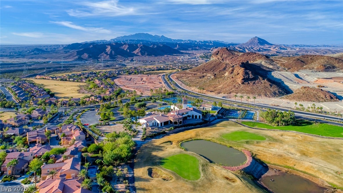 30 Strada Di Villaggio, #151, Henderson, NV 89011 Dramatic mountain ranges and a lush golf course frame this panoramic desert landscape.