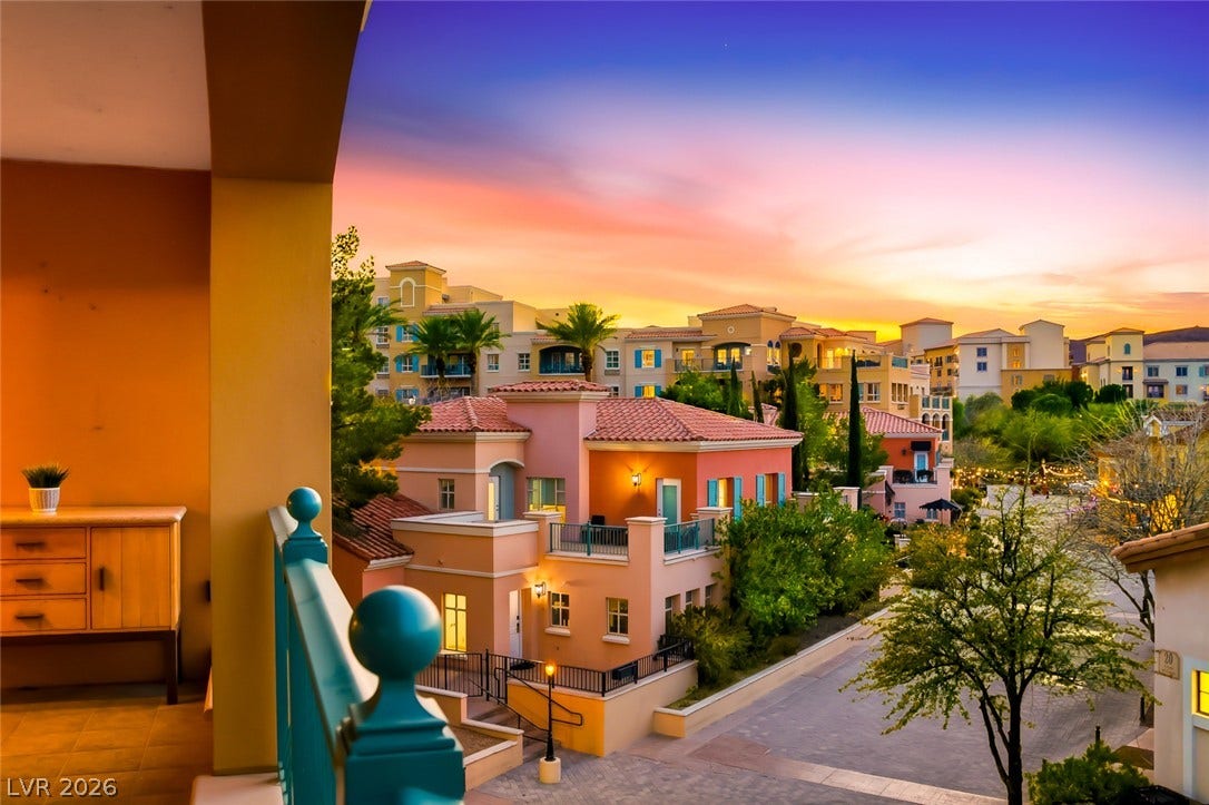 30 Strada Di Villaggio, #151, Henderson, NV 89011 Vibrant sunset skies frame the sweeping neighborhood views from this private covered balcony.