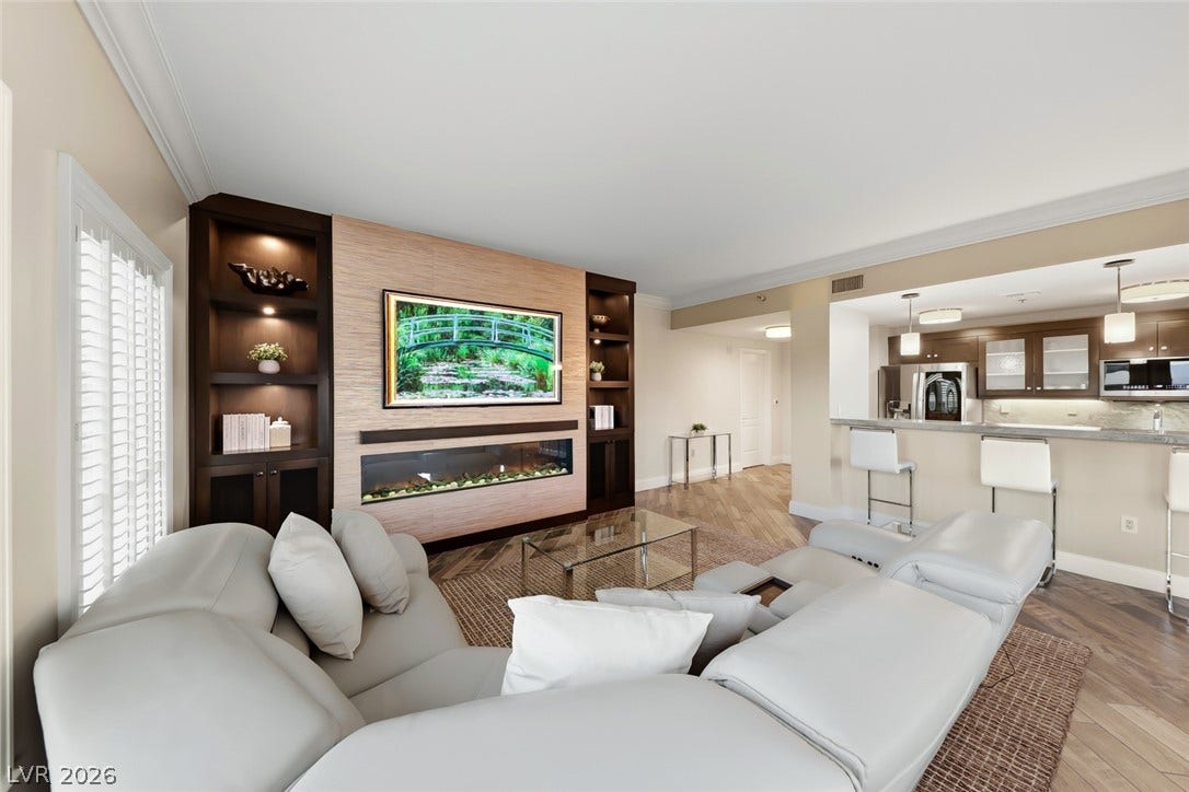 30 Strada Di Villaggio, #151, Henderson, NV 89011 Herringbone patterned wood floors guide the eye toward a contemporary linear fireplace.