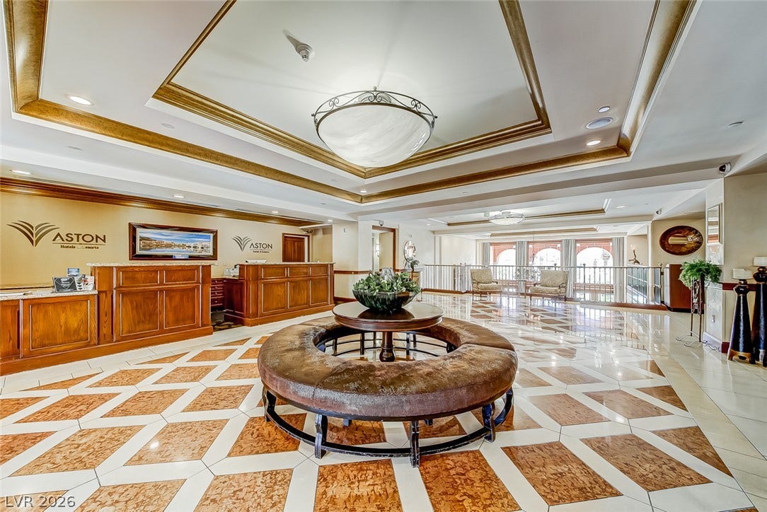 30 Strada Di Villaggio, #151, Henderson, NV 89011 Gilded tray ceilings and intricate tile flooring define this grand reception lobby entrance.