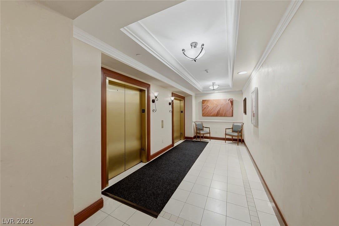 30 Strada Di Villaggio, #151, Henderson, NV 89011 Gleaming tile floors and architectural crown molding frame the secure dual-elevator entrance foyer.