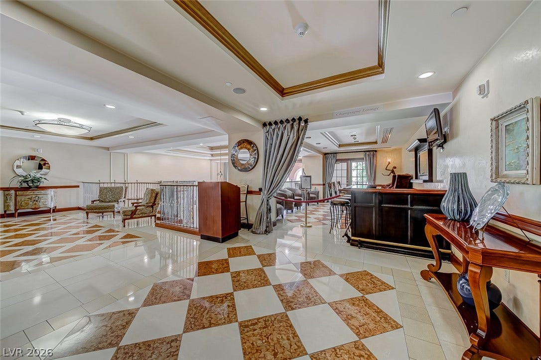 30 Strada Di Villaggio, #151, Henderson, NV 89011 Polished tile flooring and elegant tray ceilings define this expansive multi-level reception area.