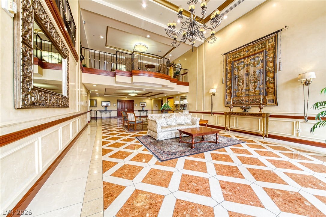 30 Strada Di Villaggio, #151, Henderson, NV 89011 Gleaming patterned tile flooring and towering ceilings with elegant crown molding define this grand entrance foyer.