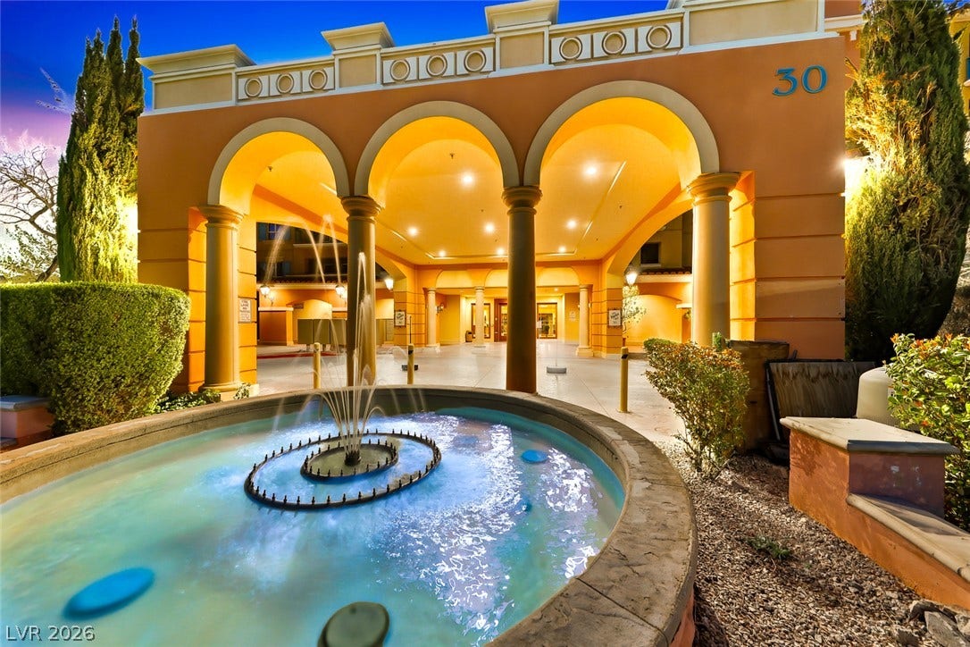 30 Strada Di Villaggio, #151, Henderson, NV 89011 Grand arches and a sparkling stone fountain frame this elegant Mediterranean-style entrance canopy.