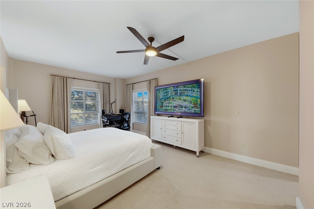 30 Strada Di Villaggio, #151, Henderson, NV 89011 Plentiful natural light streams across this comfortable bedroom through large windows.