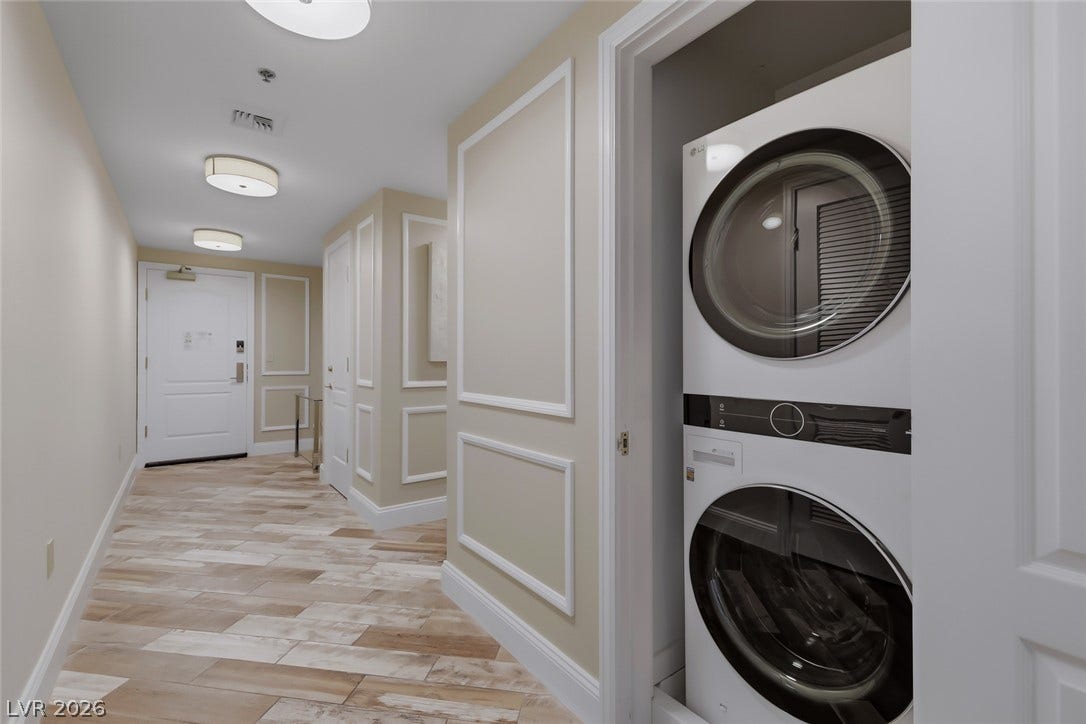 30 Strada Di Villaggio, #151, Henderson, NV 89011 Elegant wall molding and durable tile floors lead past a convenient stacked laundry closet.