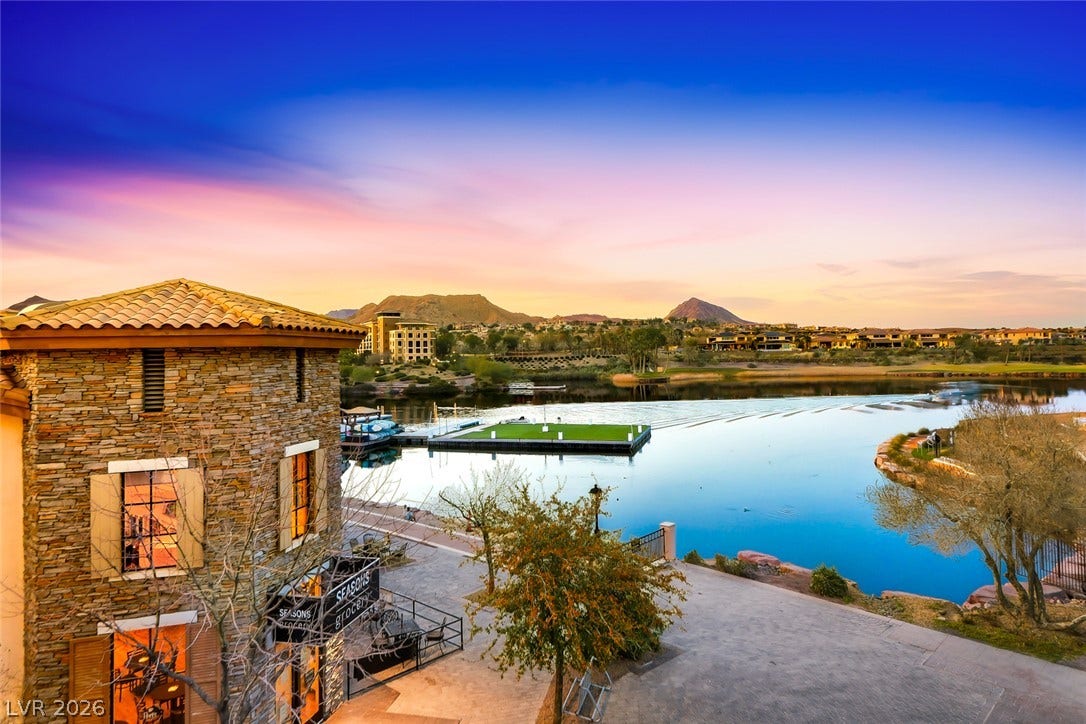 30 Strada Di Villaggio, #151, Henderson, NV 89011 Scenic water views stretch toward the mountains under a vibrant evening sky.