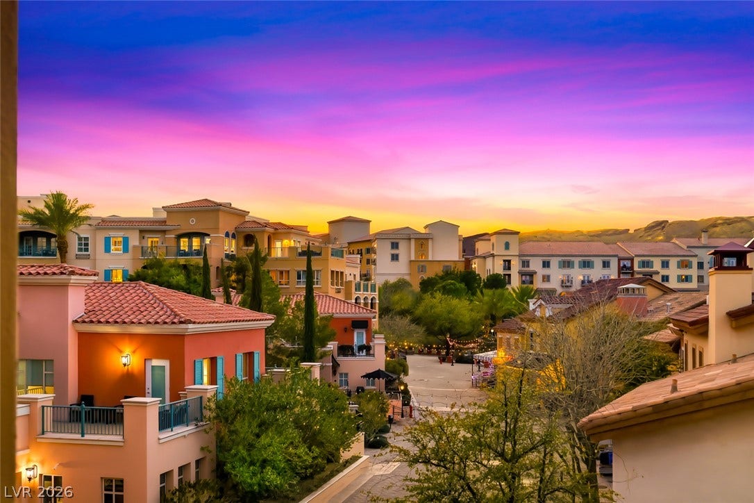 30 Strada Di Villaggio, #151, Henderson, NV 89011 Vibrant sunset skies frame the Mediterranean-inspired architecture of this charming neighborhood community.
