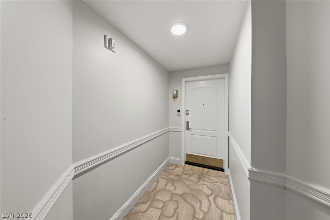 30 Strada Di Villaggio, #151, Henderson, NV 89011 Elegant trim work runs along the walls of this private entrance foyer.
