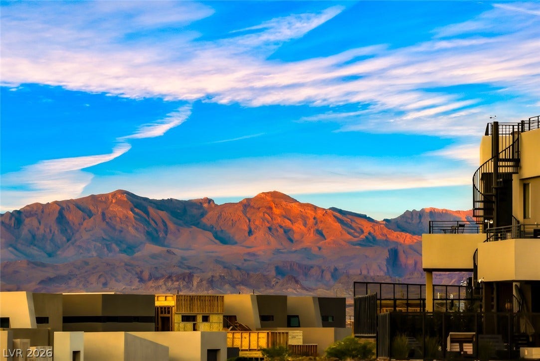 30 Strada Di Villaggio, #151, Henderson, NV 89011 Dramatic mountain peaks rise majestically behind the contemporary multi-level architecture.