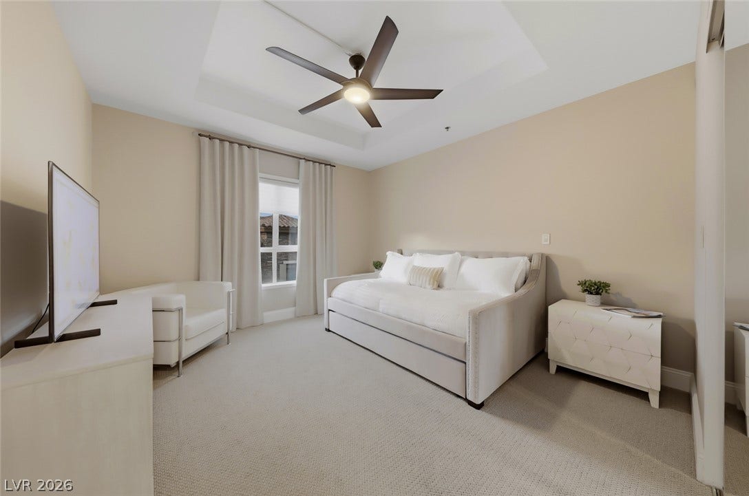 30 Strada Di Villaggio, #151, Henderson, NV 89011 Plush carpeting anchors this inviting space beneath an elegant recessed tray ceiling.