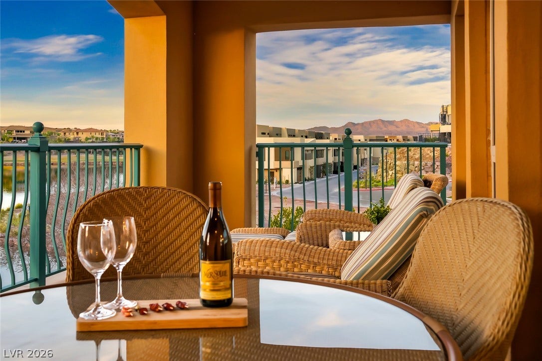 30 Strada Di Villaggio, #151, Henderson, NV 89011 Scenic mountain and neighborhood vistas frame this covered terrace designed for outdoor relaxation.