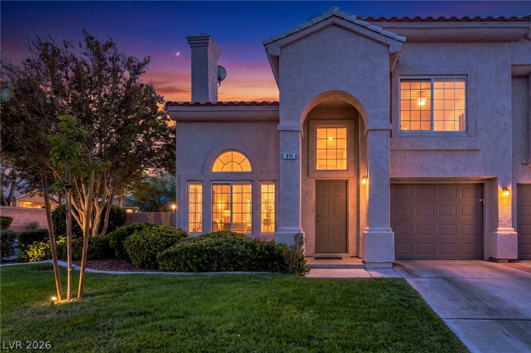 511 Armenian Place, Henderson, NV 89052 An arched entry and tile roof define the facade of this multi-level home.