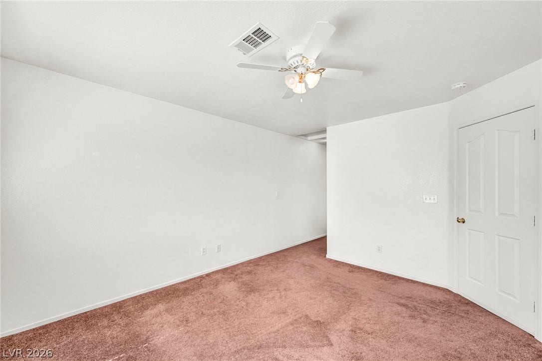 511 Armenian Place, Henderson, NV 89052 Soft carpeting underfoot defines this versatile bedroom space featuring crisp walls.