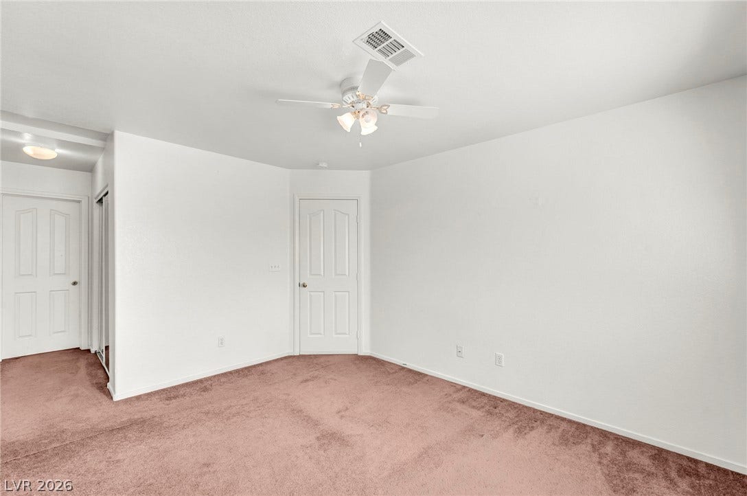 511 Armenian Place, Henderson, NV 89052 Plush wall-to-wall carpeting and clean neutral walls anchor this versatile secondary bedroom space.