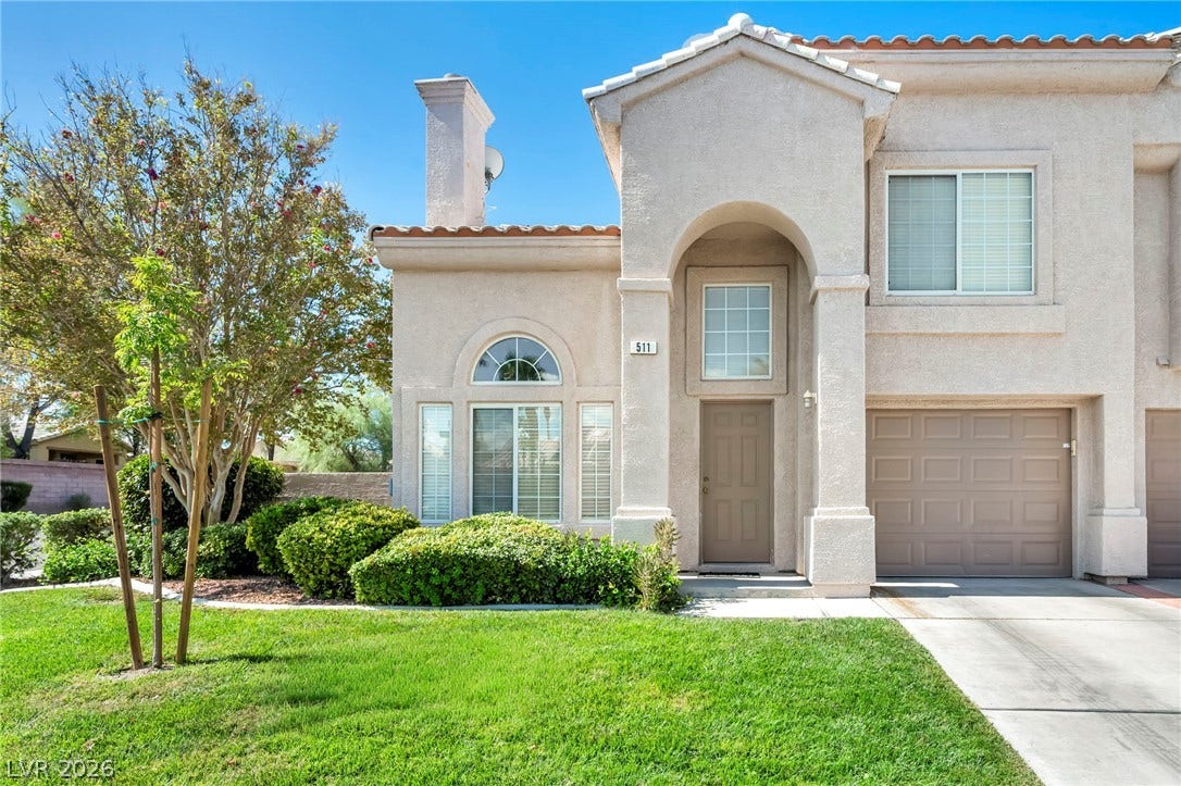 511 Armenian Place, Henderson, NV 89052 Stucco exterior surfaces and an arched entry accent the facade of this multi-level home.