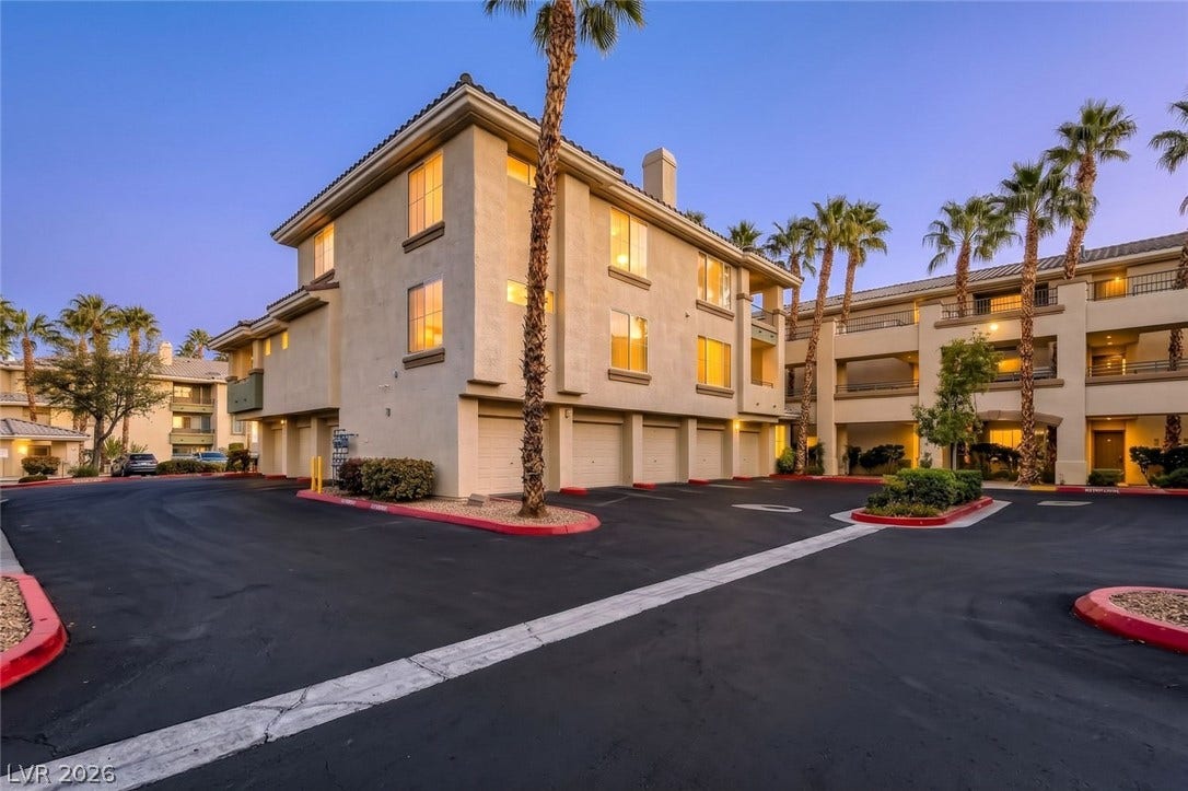 7173 S Durango Drive, #212, Las Vegas, NV 89113 Multi-level stucco exteriors feature integrated garages beneath classic tiled rooflines and tall palms.