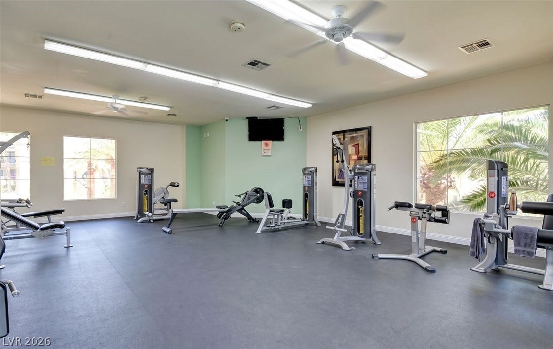 7173 S Durango Drive, #212, Las Vegas, NV 89113 Large windows bring natural light into this spacious wellness area featuring durable rubber flooring.