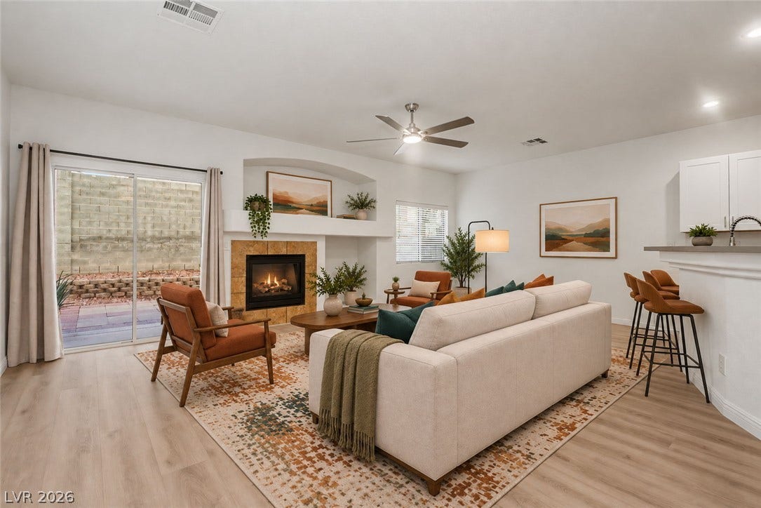 1555 Ward Frontier Lane, Henderson, NV 89002 An inviting fireplace serves as the focal point in this open living area.