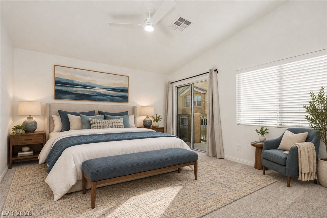 1555 Ward Frontier Lane, Henderson, NV 89002 Sliding glass doors open to a private balcony from this airy master bedroom.