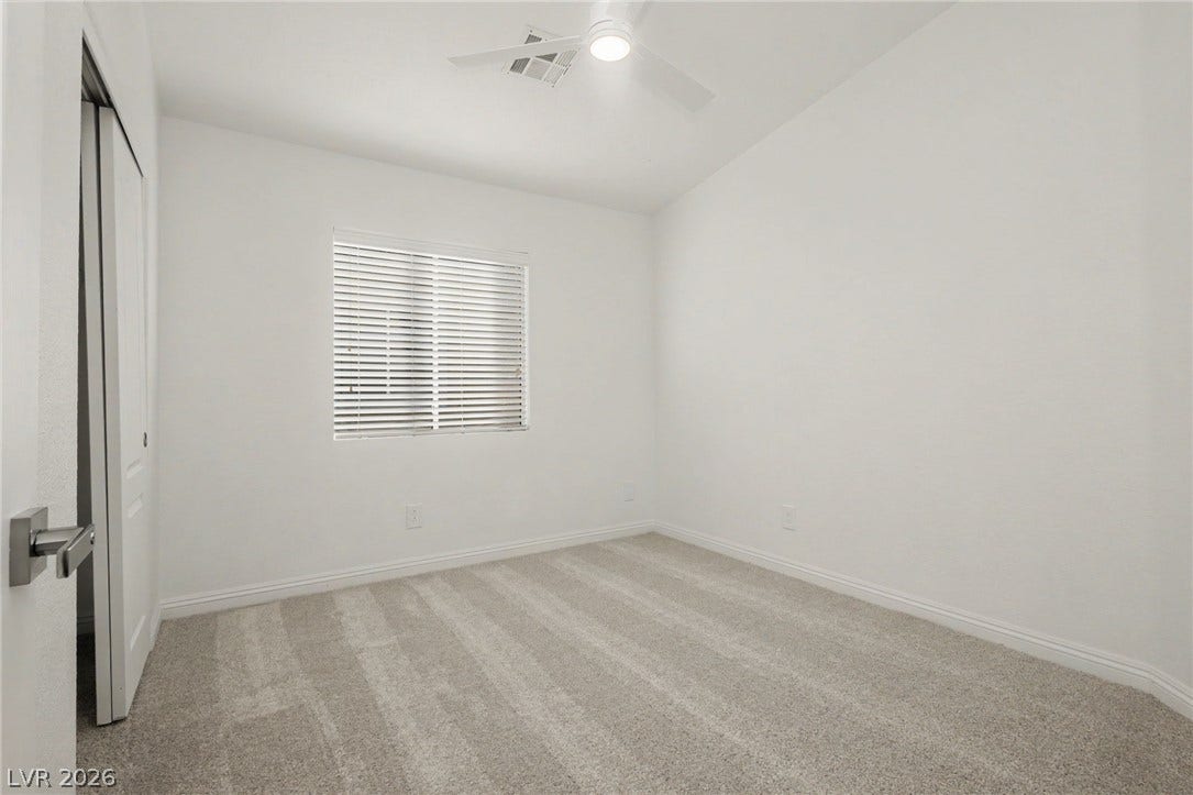 1555 Ward Frontier Lane, Henderson, NV 89002 Soft carpeting pairs with neutral walls to create a comfortable and versatile bedroom space.