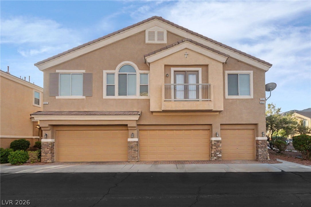 1555 Ward Frontier Lane, Henderson, NV 89002 Symmetry and classic stucco finishes define this multi-family exterior featuring multi-car garage storage.