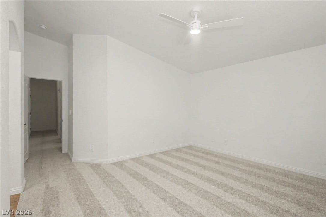 1555 Ward Frontier Lane, Henderson, NV 89002 High ceilings and neutral plush carpeting define this versatile interior space.