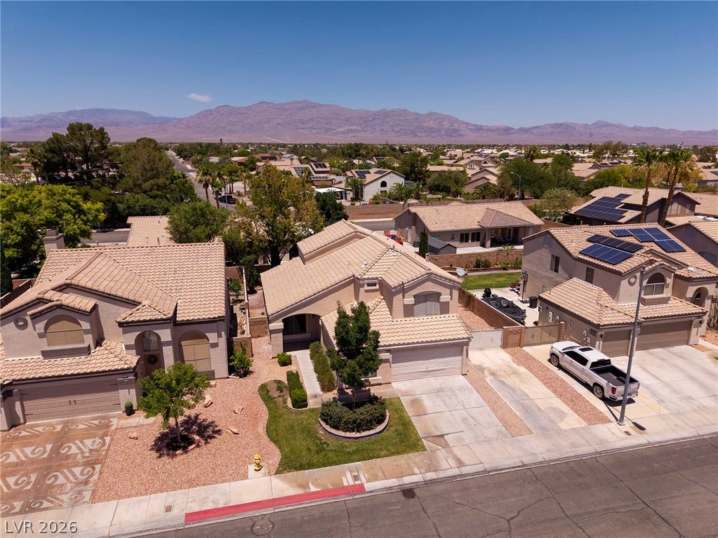An aerial perspective showcases a vibrant neighborhood in 89130 Copper Crest.