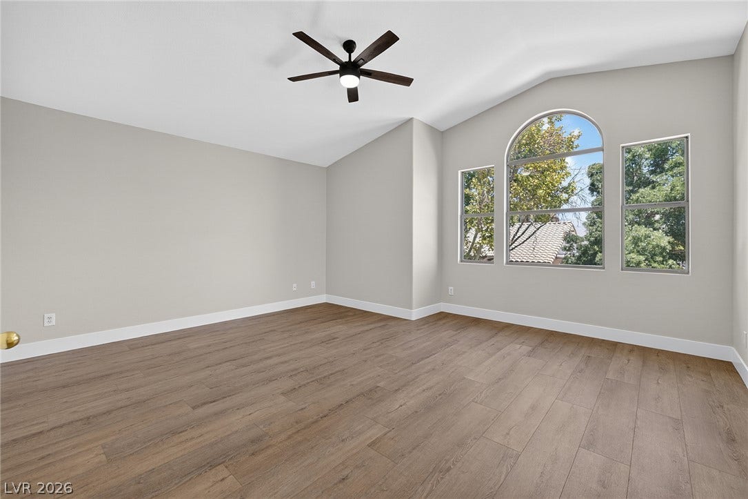 A spacious room with vaulted ceilings, northern exposure and abundant natural light.