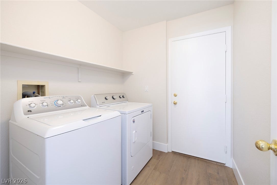 Dedicated laundry room includes the washer and gas dryer.