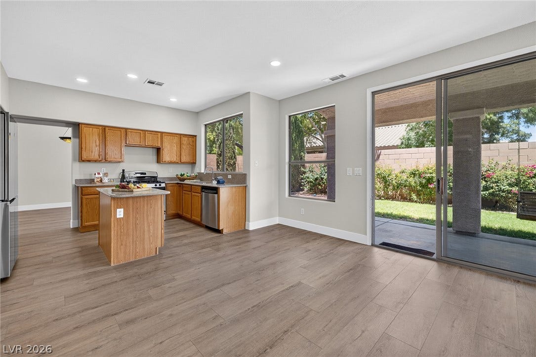 Open to the Family Room, the well-appointed kitchen features a central island plus a dedicated Breakfast Nook and a direct view of the private outdoor living space.