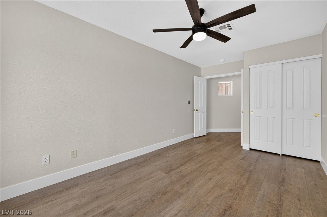 Streamlined design with a contemporary ceiling fan, Bedroom #5.